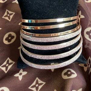 Set of 7 vintage gold and sparkling pink bangle bracelets